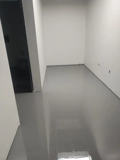 Glossy gray epoxy floor in a corridor