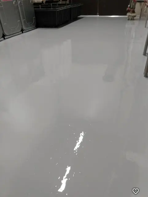 High-gloss gray epoxy floor in a storage area